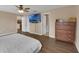 Bedroom with a ceiling fan, hardwood floors, and a TV on the wall at 2963 Beckwith St, Deltona, FL 32738