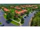 An aerial view of the townhome community with mature landscaping and convenient parking at 3002 Secret Lake Dr, Kissimmee, FL 34747