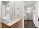 Bathroom with a sleek vanity, well-lit mirror, and ample counter space, conveniently located near the hallway at 3002 Secret Lake Dr, Kissimmee, FL 34747