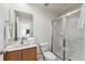 Well-lit bathroom featuring a shower with glass doors and modern fixtures, providing a clean and sleek aesthetic at 3002 Secret Lake Dr, Kissimmee, FL 34747