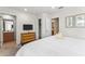 Comfortable bedroom with a dresser, TV, and easy access to the bathroom, offering a relaxing retreat at 3002 Secret Lake Dr, Kissimmee, FL 34747
