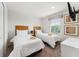 Cozy bedroom featuring two twin beds, neutral decor, and bright natural light, perfect for relaxation at 3002 Secret Lake Dr, Kissimmee, FL 34747
