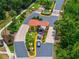 Aerial view of Encantada community entrance with fountain and landscaping at 3002 Secret Lake Dr, Kissimmee, FL 34747