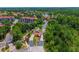 Community entrance with gatehouse, mature trees, and landscaping at 3002 Secret Lake Dr, Kissimmee, FL 34747