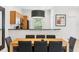 Comfortable dining area with seating for six, adjacent to a kitchen with modern appliances at 3002 Secret Lake Dr, Kissimmee, FL 34747