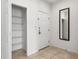 Bright entryway with a closet, mirror, and tile flooring at 3002 Secret Lake Dr, Kissimmee, FL 34747