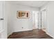 Inviting hallway featuring hard wood floors, light walls, and art work, providing a warm welcome at 3002 Secret Lake Dr, Kissimmee, FL 34747