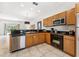 Well-equipped kitchen with granite countertops, stainless steel appliances, and ample cabinet space at 3002 Secret Lake Dr, Kissimmee, FL 34747