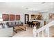 Open-concept living space with modern furnishings and decor adjacent to a dining and kitchen area at 3002 Secret Lake Dr, Kissimmee, FL 34747