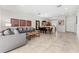 Inviting living space with tile floors and an open layout to the dining and kitchen areas at 3002 Secret Lake Dr, Kissimmee, FL 34747