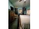 Bedroom with dark carpet, storage cabinets, and a television for entertainment at 319 N Scenic Hwy, Frostproof, FL 33843
