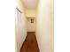 Hallway with laminate flooring and a closet, freshly painted walls add warmth at 319 N Scenic Hwy, Frostproof, FL 33843