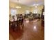 Bright, open living space combining the dining and living areas with hardwood floors and comfortable furnishings at 319 N Scenic Hwy, Frostproof, FL 33843