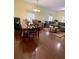 Open-concept living area with a dining set, comfortable seating, and ample space for relaxation at 319 N Scenic Hwy, Frostproof, FL 33843