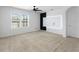 Bright bedroom featuring a modern ceiling fan and an accent wall at 341 Alexzander Way, Winter Haven, FL 33881