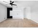 Bright bedroom featuring a modern ceiling fan and a feature wall at 341 Alexzander Way, Winter Haven, FL 33881