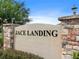 Monument sign that says Jace Landing in black, set against a stone and stucco wall at 341 Alexzander Way, Winter Haven, FL 33881