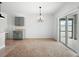 Dining room features modern lighting, eat-in dining area, and sliding glass doors at 341 Alexzander Way, Winter Haven, FL 33881