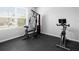 Private gym space featuring workout machines, black rubber floor, and natural light from a large window at 341 Alexzander Way, Winter Haven, FL 33881