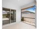 Screened-in lanai with white tiled floor and views of the backyard at 341 Alexzander Way, Winter Haven, FL 33881