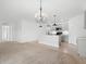 Bright living room with a view of the kitchen and breakfast bar seating at 341 Alexzander Way, Winter Haven, FL 33881