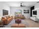 Bright living room featuring comfortable seating, area rug, and outdoor views at 341 Alexzander Way, Winter Haven, FL 33881