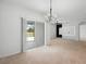 Bright living room with sliding glass doors leading to an outdoor patio at 341 Alexzander Way, Winter Haven, FL 33881