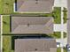 Bird's eye view of neighborhood roofs showing the roofs, lawns, and driveways of the homes at 4122 Sagefield Dr, St Cloud, FL 34773