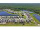 Scenic aerial view of new development featuring many homes and multiple serene lakes at 4122 Sagefield Dr, St Cloud, FL 34773