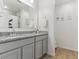 Stylish bathroom with double vanity sinks, granite countertop, and modern fixtures at 4122 Sagefield Dr, St Cloud, FL 34773