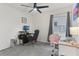 Cozy bedroom with a ceiling fan, a window for natural light, and carpet flooring at 4122 Sagefield Dr, St Cloud, FL 34773