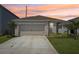 Charming home with a two-car garage, landscaped yard, and freshly painted exterior, located on a quiet street at 4122 Sagefield Dr, St Cloud, FL 34773