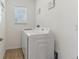 Efficient laundry room with modern appliances and natural light from the window at 4122 Sagefield Dr, St Cloud, FL 34773