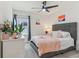 Comfortable main bedroom featuring a ceiling fan, bright windows, and calming decor at 4122 Sagefield Dr, St Cloud, FL 34773