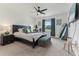 Spacious main bedroom with large bed, dark accents, fan, and natural light at 4122 Sagefield Dr, St Cloud, FL 34773