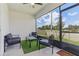 Enclosed patio with neutral furniture and views of the fenced backyard at 4122 Sagefield Dr, St Cloud, FL 34773