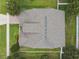 Aerial view of a home showcasing its roof, mature trees, and surrounding yard in a residential neighborhood setting at 4133 Foxhound Dr, Clermont, FL 34711