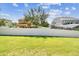 Spacious backyard featuring a white vinyl fence, offering privacy and a secure space for outdoor activities and enjoyment at 4133 Foxhound Dr, Clermont, FL 34711