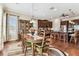 Dining area adjacent to kitchen features elegant furnishings and ample natural light at 4133 Foxhound Dr, Clermont, FL 34711