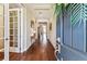 Inviting entryway with hardwood floors, elegant decor, and views into the home's living spaces at 4133 Foxhound Dr, Clermont, FL 34711