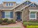 Attractive home with stone detailing, a welcoming entrance, and beautifully landscaped front yard at 4133 Foxhound Dr, Clermont, FL 34711