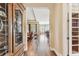 Spacious hallway with hardwood floors, elegant archways, and views into the living and dining areas at 4133 Foxhound Dr, Clermont, FL 34711