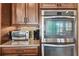 Built-in double oven and microwave complement the stainless appliances in this modern kitchen at 4133 Foxhound Dr, Clermont, FL 34711