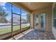 Spacious screened patio with brick pavers and views of the backyard, ideal for enjoying outdoor moments at 4133 Foxhound Dr, Clermont, FL 34711