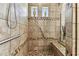 Shower with grab bar, tiled bench and decorative vase windows at 4133 Foxhound Dr, Clermont, FL 34711