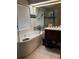 Bright bathroom featuring a soaking tub, modern vanity, and contemporary fixtures at 4186 Buglers Rest Pl, Casselberry, FL 32707