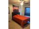 Cozy bedroom featuring orange bedspread at 4186 Buglers Rest Pl, Casselberry, FL 32707