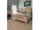 Cozy bedroom with natural light and tile flooring at 4186 Buglers Rest Pl, Casselberry, FL 32707