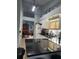 Bright kitchen with white cabinets, dark countertops, and stainless steel appliances at 4186 Buglers Rest Pl, Casselberry, FL 32707