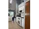 Charming kitchen features white cabinets, black countertops, and stainless steel appliances at 4186 Buglers Rest Pl, Casselberry, FL 32707